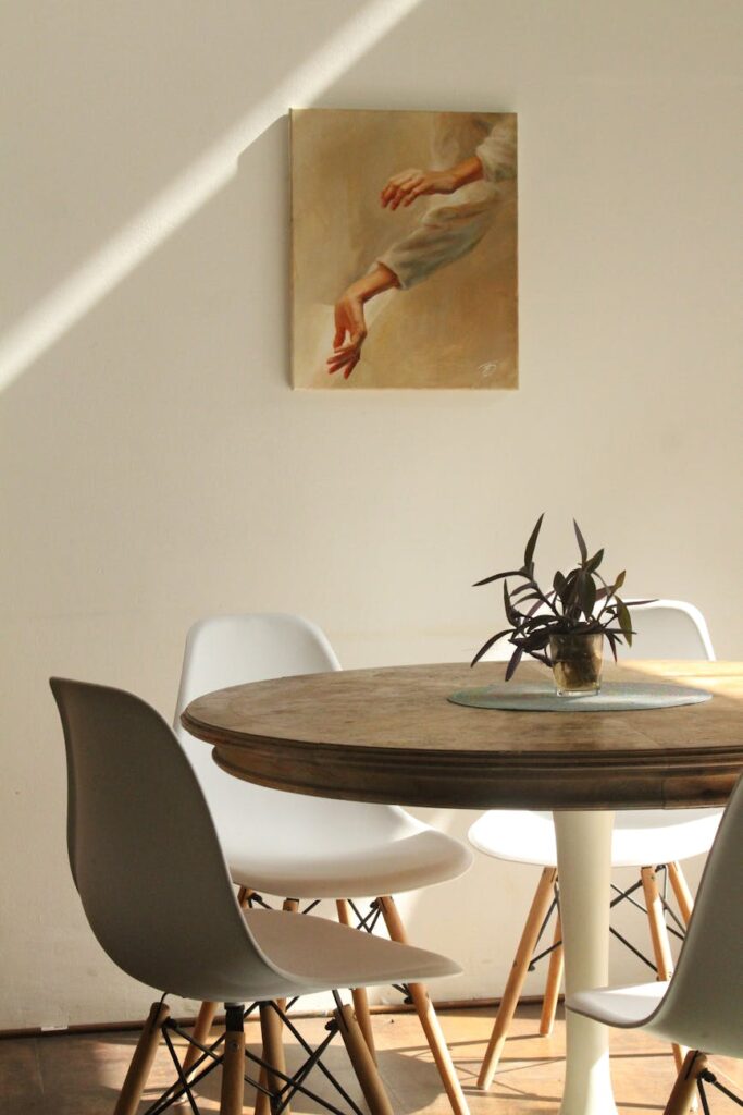 empty white chairs beside table